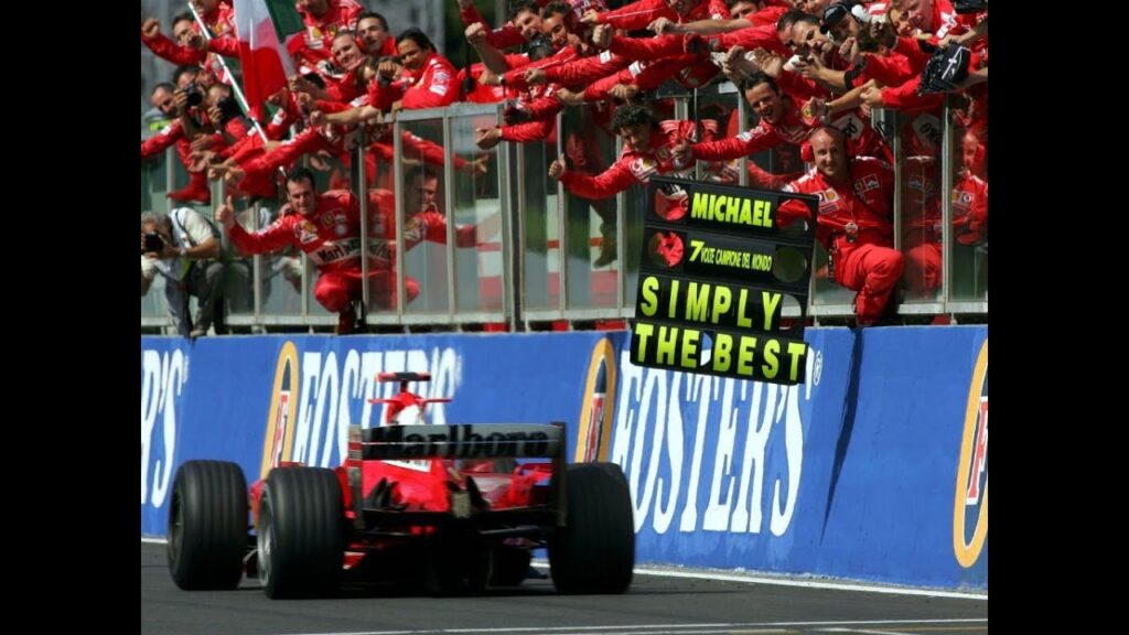les mécaniciens qui encouragent schumacher après son 7e titre